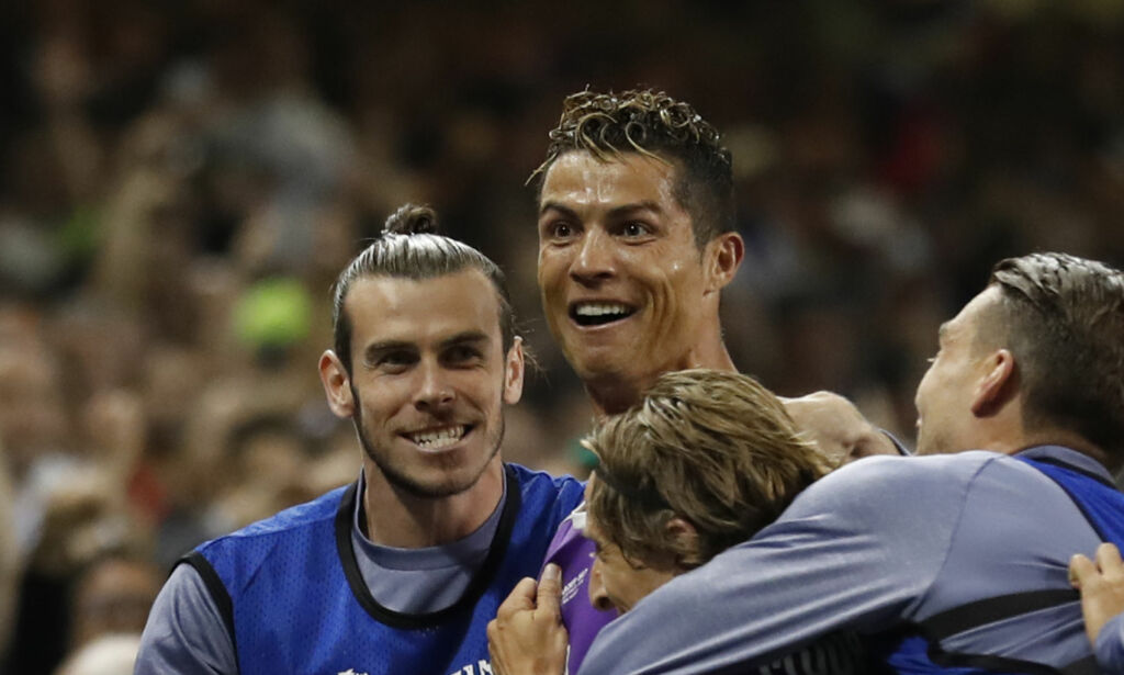 Britain Soccer Football - Juventus v Real Madrid - UEFA Champions League Final - The National Stadium of Wales, Cardiff - June 3, 2017 Real Madrid's Cristiano Ronaldo celebrates scoring their third goal with Gareth Bale and teammates Reuters / Carl Recine Livepic