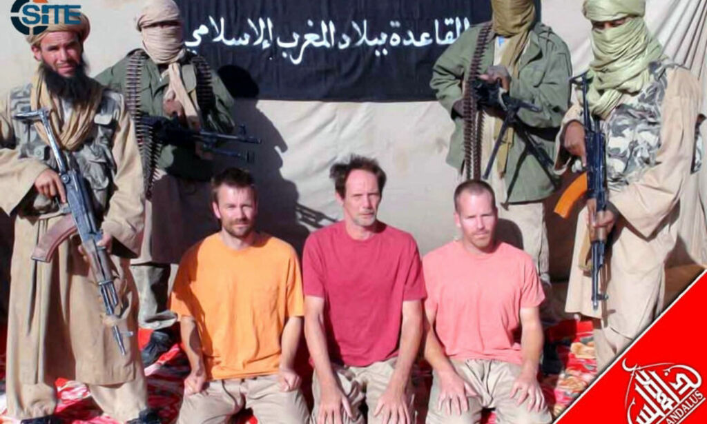 RESTRICTED TO EDITORIAL USE - MANDATORY CREDIT " AFP PHOTO / SITE MONITORING SERVICE "
This still image obtained December 11, 2011, courtesy of the SITE Monitoring Service shows three kidnapped Westerners by Al-Qaeda. According to the SITE Monitoring Service, Al-Qaeda in the Islamic Maghreb (AQIM) released its official communiqué on jihadist forums claiming responsibility for the kidnapping of four Europeans and a South African in Mali in two separate incidents, and provided pictures of the captives. The message was issued on December 11, 2011, three days after the Nouakchott News Agency (Agence Nouakchott d?Information) had posted it after receiving it via e-mail. AQIM kidnapped two French nationals, Philippe Verdon and Serge Lazarevic, in Mali on November 24, 2011, and kidnapped the others in Timbuktu on November 25. AQIM identified the French as working for the intelligence, and identified the three others as Europeans but didn?t indicate their nationality. In addition to claiming the kidnappings in Mali, AQIM denied kidnapping two Spanish nationals and an Italian from a refugee camp near Tindouf in Algeria. Regarding those kidnappings they did admit to perpetrating, AQIM explained that they are revenge for the ?repeated aggression? of France in the Sahel and the ?continuous foolish policies? of French President Nicolas Sarkozy. Addressing Sarkozy, the group declared: ?So, if you want, you have the ability to preserve their lives and release them as soon as you respond to the legitimate demands of the mujahideen; and if you want, you have the ability to kill them, whether by refusing or by being hasty and committing another uncalculated foolishness.? AFP PHOTO / SITE MONITORING SERVICE / HANDOUT = GETTY OUT = RESTRICTED TO EDITORIAL USE - MANDATORY CREDIT " AFP PHOTO / SITE MONITORING SERVICE " - NO MARKETING NO ADVERTISING CAMPAIGNS - DISTRIBUTED AS A SERVICE TO CLIENTS