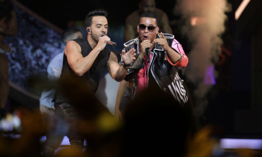 FILE - In this April 27, 2017 file photo, singers Luis Fonsi, left and Daddy Yankee perform during the Latin Billboard Awards in Coral Gables, Fla. Universal Music Latin Entertainment announced Wednesday, July 19, 2017, that "Despacito" has become the most streamed song of all time with more than 4.6 billion plays six months after its release. The song by Luis Fonsi and Daddy Yankee, and a companion remix featuring Justin Bieber, has surpassed the 4.38 billion plays recorded for the previous record holder, which was Bieber's hit "Sorry." (AP Photo/Lynne Sladky, File)