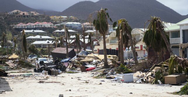 A photo taken on September 7, 2017 shows damage in Orient Bay on the French Carribean island of Saint-Martin, after the passage of Hurricane Irma.
France, the Netherlands and Britain on September 7 rushed to provide water, emergency rations and rescue teams to territories in the Caribbean hit by Hurricane Irma, with aid efforts complicated by damage to local airports and harbours. The worst-affected island so far is Saint Martin, which is divided between the Netherlands and France, where French Prime Minister Edouard Philippe confirmed four people were killed and 50 more injured.
/ AFP PHOTO / Lionel CHAMOISEAU