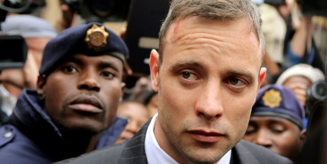 FILE PHOTO - Olympic and Paralympic track star Oscar Pistorius leaves court after appearing for the 2013 killing of his girlfriend Reeva Steenkamp in the North Gauteng High Court in Pretoria, South Africa, June 14, 2016. REUTERS/Siphiwe Sibeko/File Picture